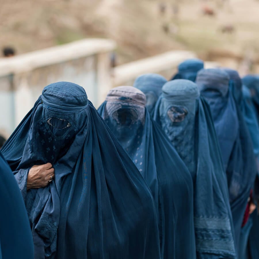 Afghan Women Wearing Burqa in Village, Staying in line for getting medical help